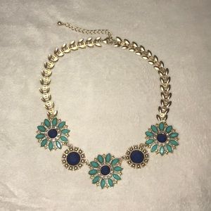 Francesca’s blue and gold necklace